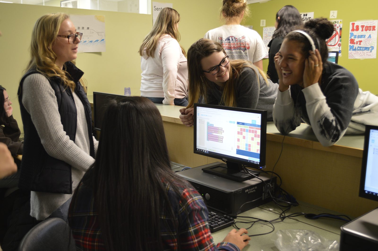 CodeHS team member leading a classroom coding activity with students during a school visit